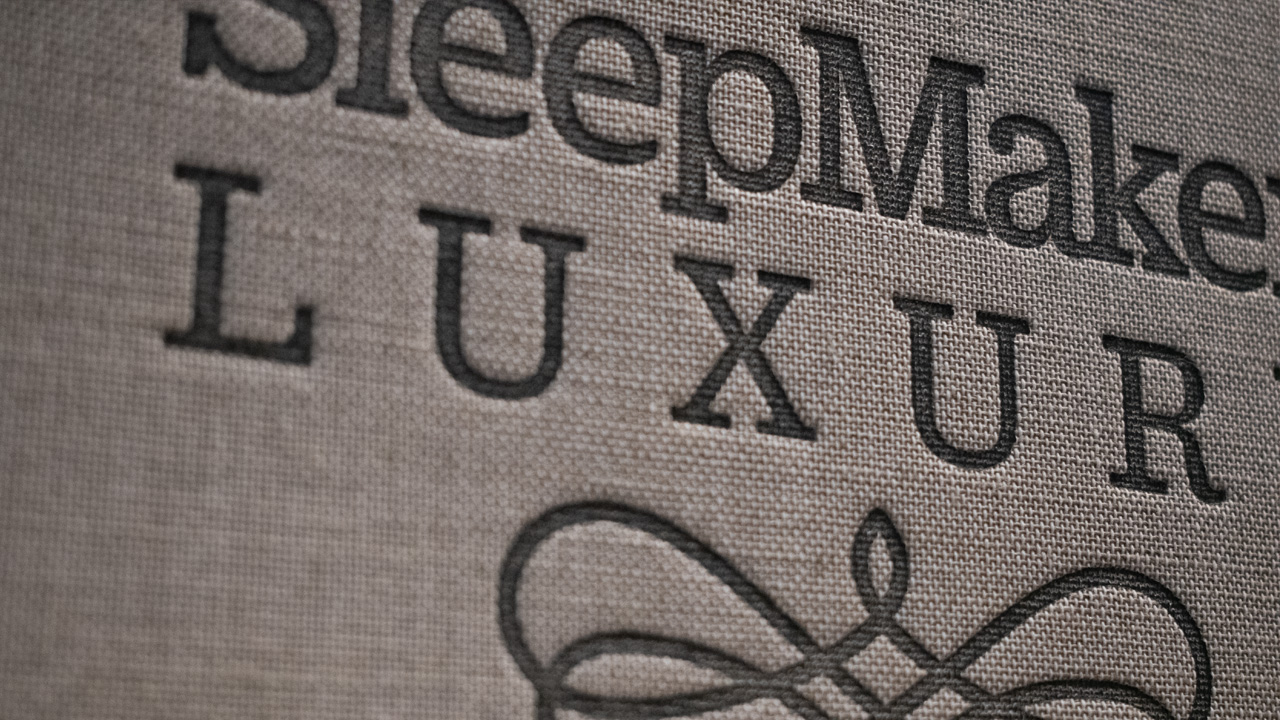 Close up shot of SleepMaker Luxury reveal book, featuring